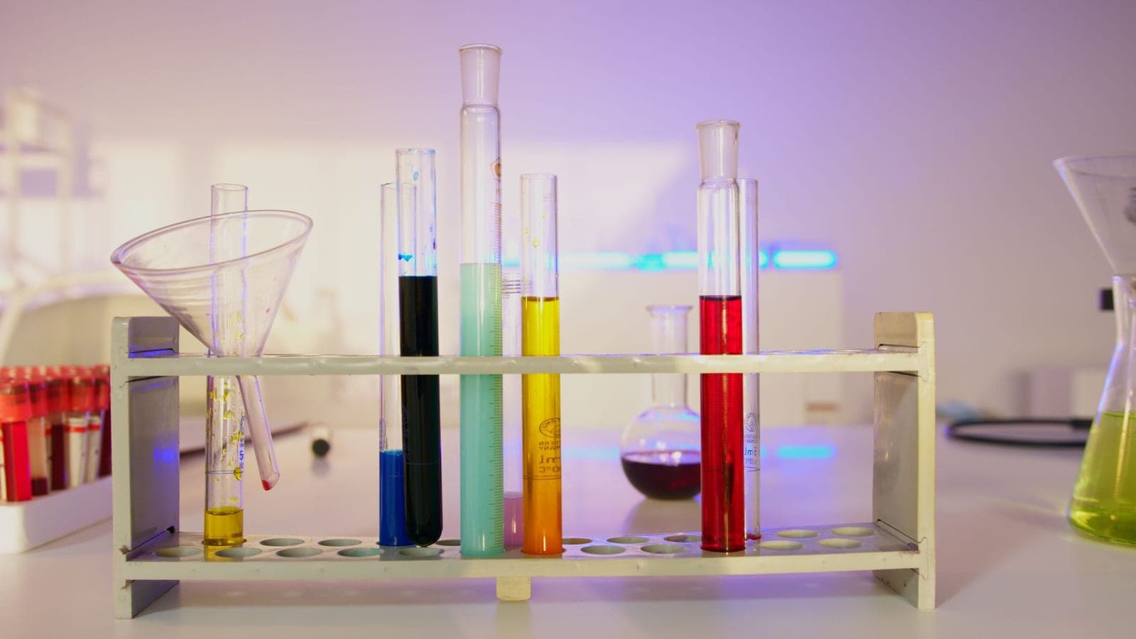 Laboratory vials with liquids in a modern research setting.